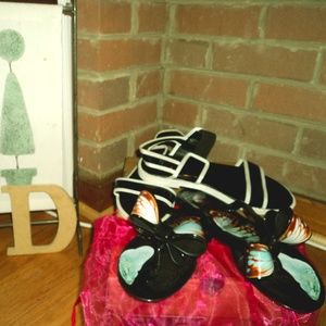 Cuteness. The butterfly is a 8 and the black 71/2